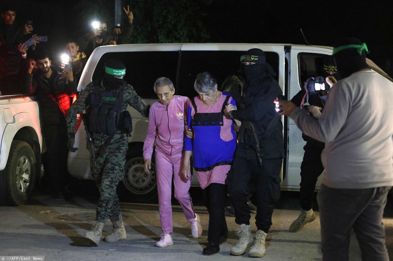 Two Israeli hostages escorted by Hamas fighters