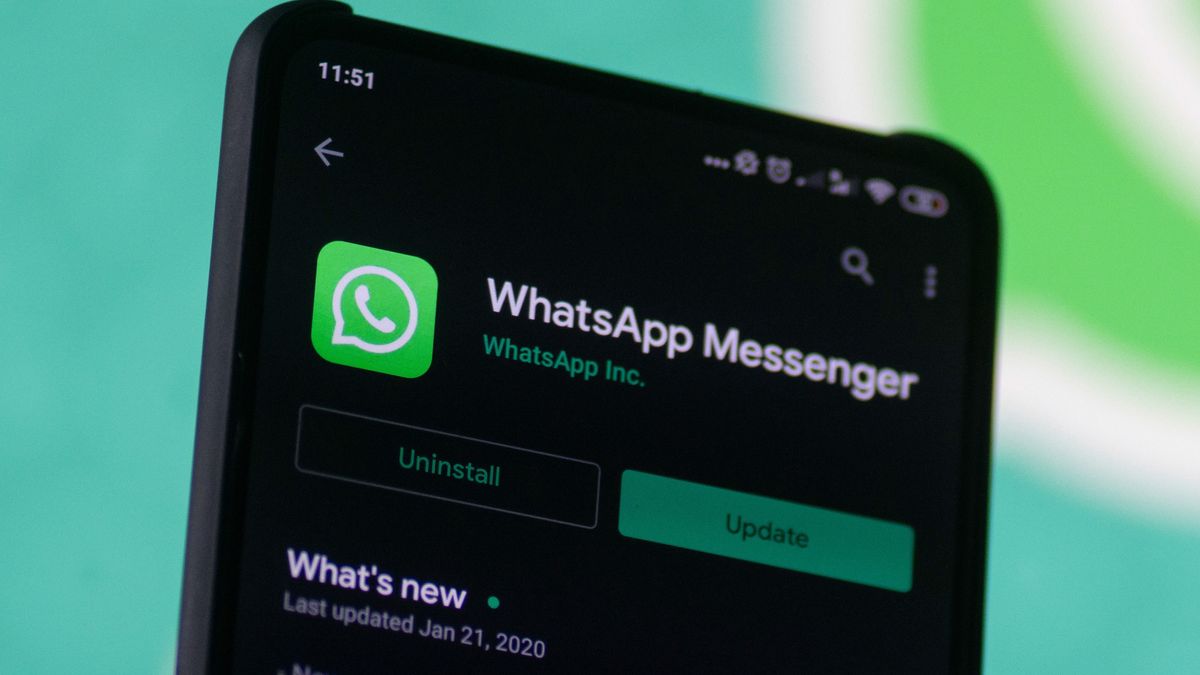 WhatsApp logo displayed on a phone screen, smartphone and keyboard are seen in this multiple exposure illustration. WhatsApp Messenger is a multiplatform mobile application that provides an encrypted instant messaging system belonging to Facebook, photo taken in Amsterdam, Netherlands on January 28, 2020 (Photo illustration by Nicolas Economou/NurPhoto via Getty Images)
