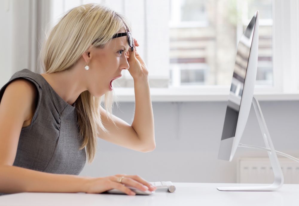 Zdjęcie This is too much! Young woman can't handle that workload anymore. pochodzi z serwisu Shutterstock