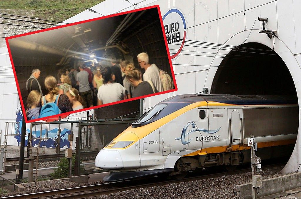 Pociąg Eurostar i ludzie czekający w tunelu pod kanałem La Manche na pociąg zastępczy