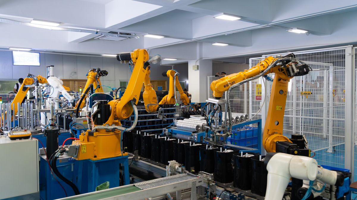 FOSHAN, CHINA - JULY 28: Industrial robots work at the coffee machine production line at Xinbao Electric Appliances Holdings Co., Ltd. on July 28, 2025 in Foshan City, Guangdong Province of China. Guangdong Xinbao Electric Appliances Holdings Co., Ltd., based in Shunde City, stands as a leading player in China's small appliance sector. For every 100 drip coffee makers sold globally, about 40 are produced by the company. (Photo by Wang Qingwu/VCG via Getty Images)