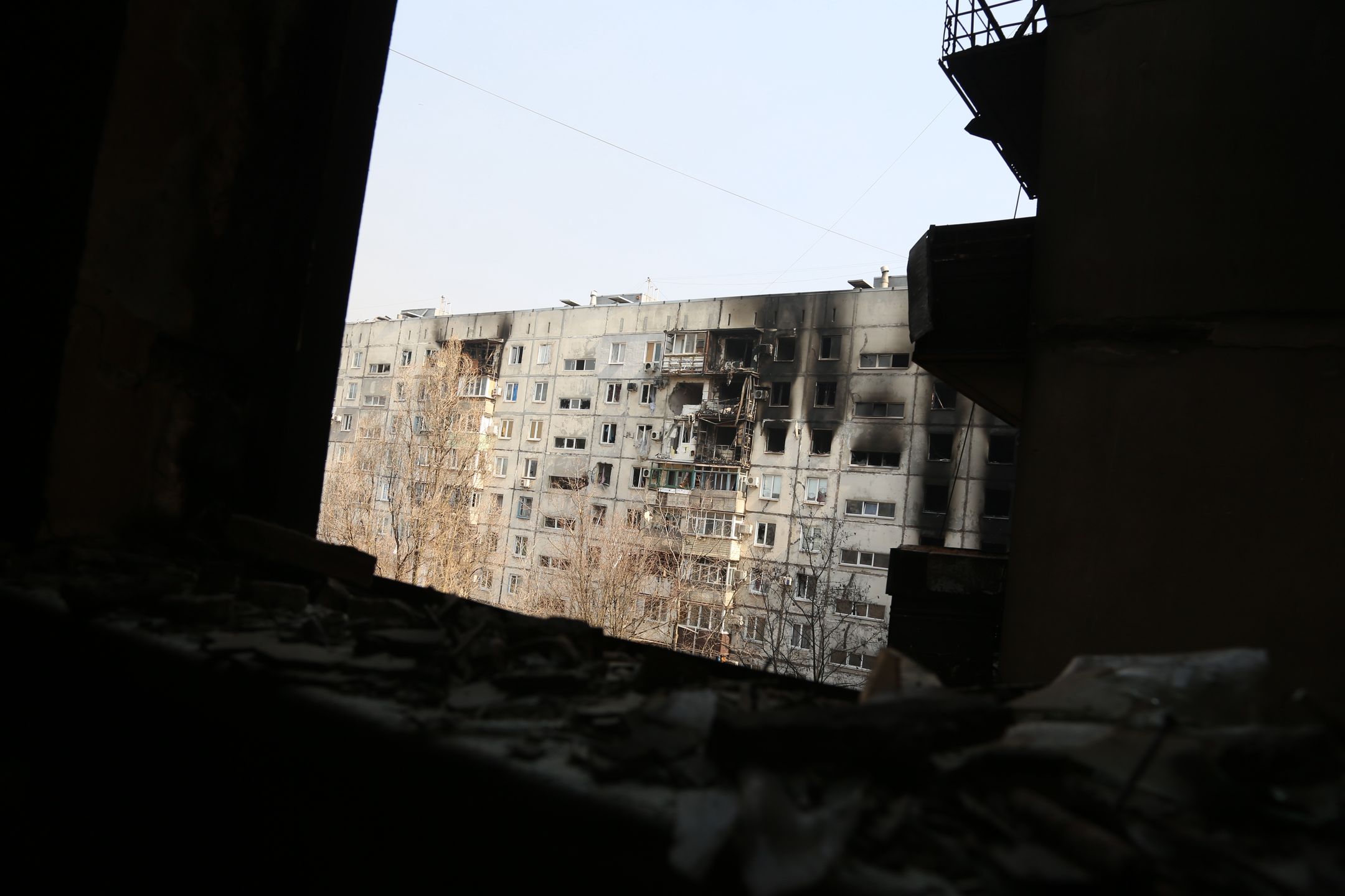 MARIUPOL, UKRAINE - MARCH 24: A view from a damaged building as civilians are being evacuated along humanitarian corridors from the Ukrainian city of Mariupol under the control of Russian military and pro-Russian separatists, on March 24, 2022. (Photo by Leon Klein/Anadolu Agency via Getty Images)