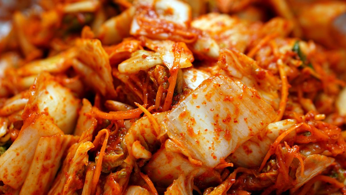 Close up photo of kimchi. Homemade Korean fermented cabbage
Kimchi, is a traditional Korean side dish of salted and fermented vegetables with a sour and spicy taste. One of the most common types of kimchi is cabbage kimchi. The striking red color, unique taste and smell make kimchi one of the most loved foods.
angga