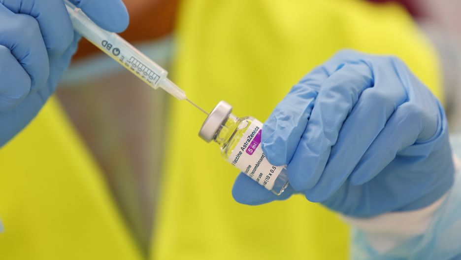 A nurse prepares an AstraZeneca vaccine from a vial after this vaccine was approved again in Spain. The massive vaccination against COVID-19 continues in Granada, Spain, on March 25, 2021. (Photo by Álex Cámara/NurPhoto via Getty Images)