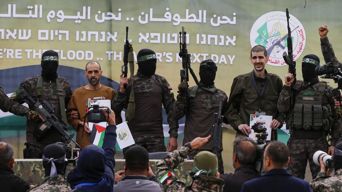 DEIR AL BALAH, GAZA - FEBRUARY 8: Israeli hostages Or Levy, Eli Sharabi, and Ohad Ben Ami being handed over to the International Committee of the Red Cross by the fighters of the Palestinian resistance group Hamas under a ceasefire and prisoner exchange agreement with Israel, in Deir al Balah, Gaza, on February 8, 2025. (Photo by Ashraf Amra/Anadolu via Getty Images)