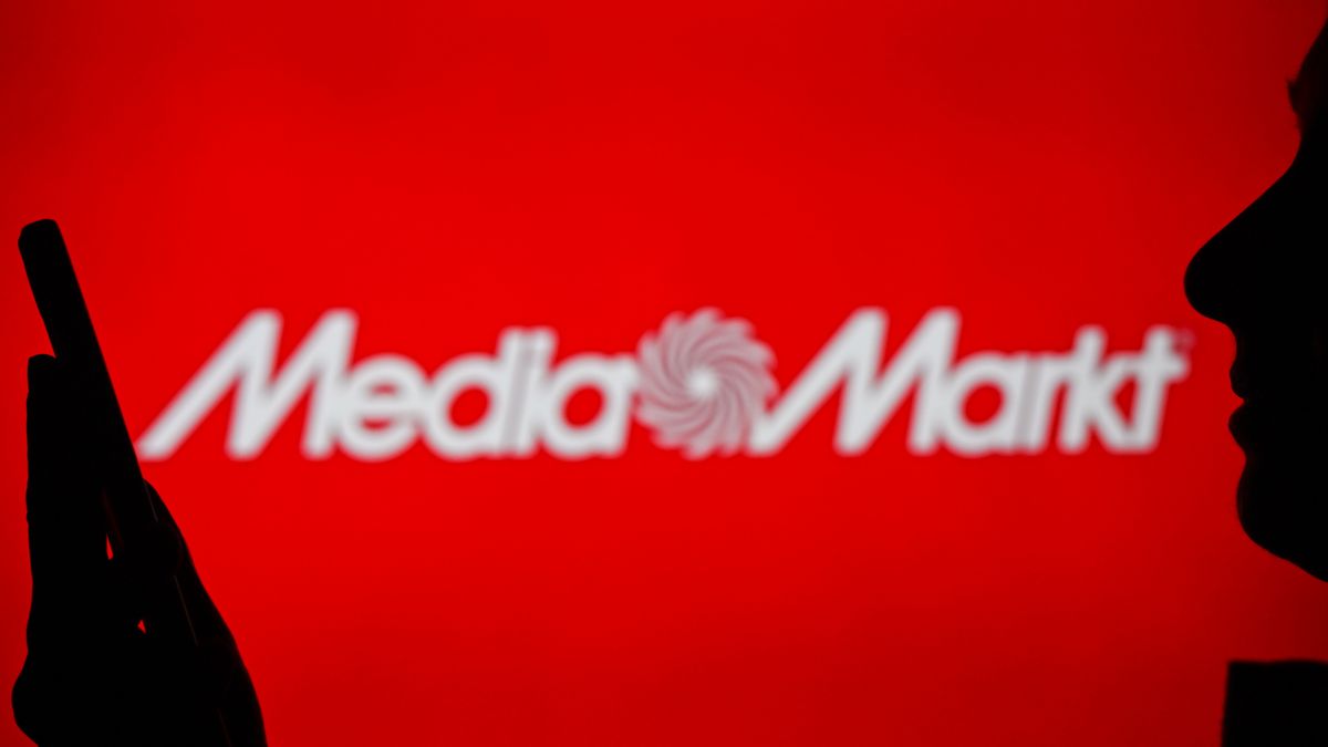 EDMONTON, CANADA - APRIL 28:
An image of a woman holding a cell phone in front of a MediaMarkt logo displayed on a computer screen, on April 29, 2024, in Edmonton, Canada. (Photo by Artur Widak/NurPhoto via Getty Images)