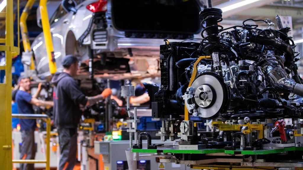 Ford Motor Co. Plant as Automaker Sees Electric Future
A Ford Focus automobile combustion engine, suspension unit and front brake disc sit on a hydraulic platfrom on the engine and body wedding line inside the Ford Motor Co. factory in Saarlouis, Germany, on Wednesday, Sept. 25, 2019. Ford recently announced it expects 'electrified' vehicles  which include mild hybrids, traditional hybrids, plug-in electric hybrids (PHEVs) and battery electric vehicles (BEVs)  to make up over 50% of its passenger vehicle sales by year-end 2022. Photographer: Krisztian Bocsi/Bloomberg via Getty Images
Bloomberg
employment, work, fabrication, jobs