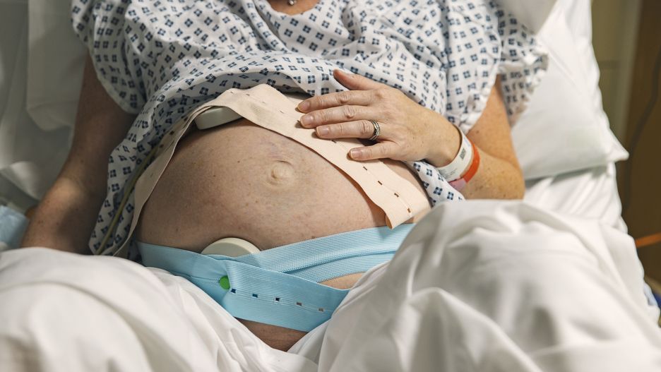 Unrecognisable pregnant woman in delivery room getting ready to give birth
An unrecognisable mature pregnant woman lies on a hospital delivery bed as she has fetal monitoring. Cardiotocography is usually called a 'CTG' by medical staff. It can be used to monitor a baby's heart rate and a mother's contractions during pregnancy
Justin Paget
