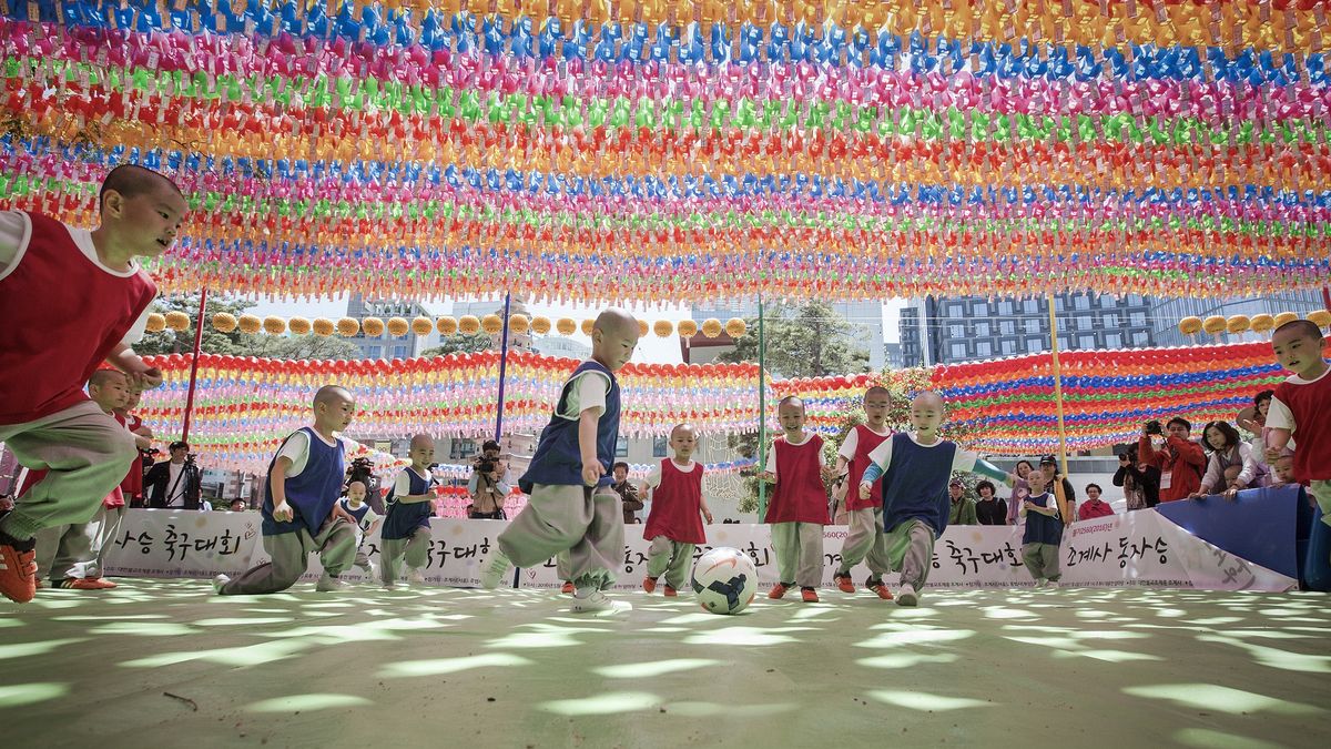 SEOUL, SOUTH KOREA - (ARCHIVE): A file photo dated May 4, 2016 shows children, who entered temples, having an experience of monks' life for weeks, take part in the Little Monk Soccer Match under lanterns at Jogye temple in Seoul, South Korea. (Photo by Kim Jong Hyun/Anadolu Agency via Getty Images)