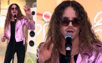 Michał Szpak w różowej kurtce śpiewa w "Dzień Dobry TVN"