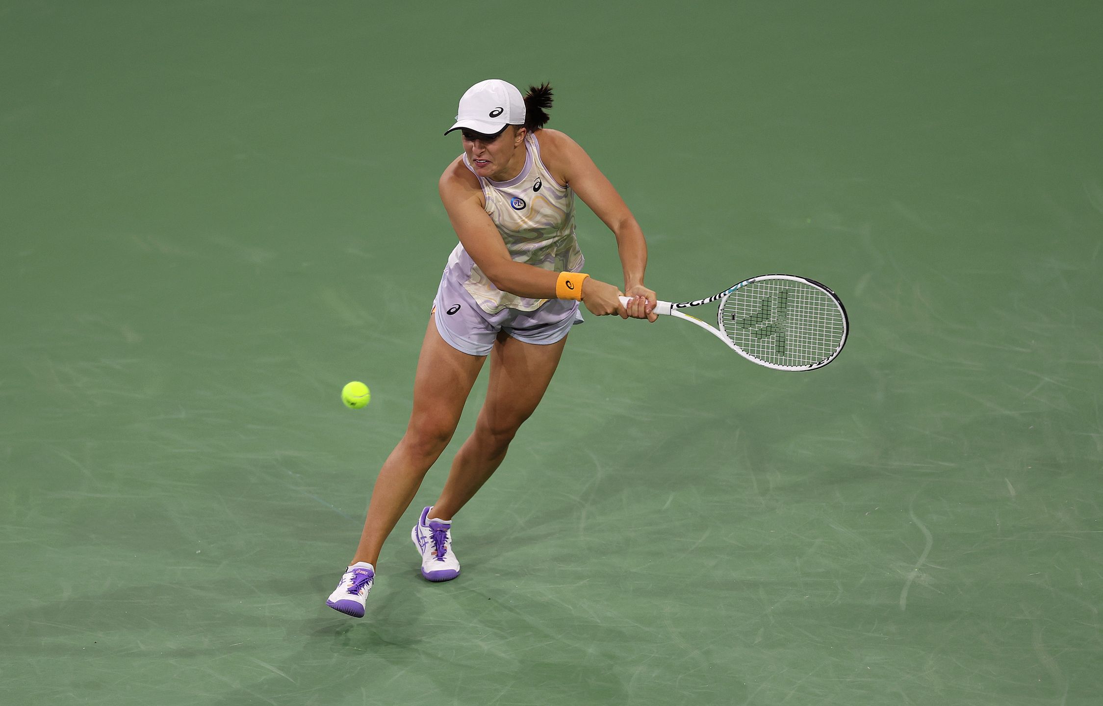 INDIAN WELLS, CALIFORNIA - MARCH 17:  Iga Swiatek of Poland in action against Elena Rybakina in the semi final during the BNP Paribas Open on March 17, 2023 in Indian Wells, California. (Photo by Julian Finney/Getty Images)