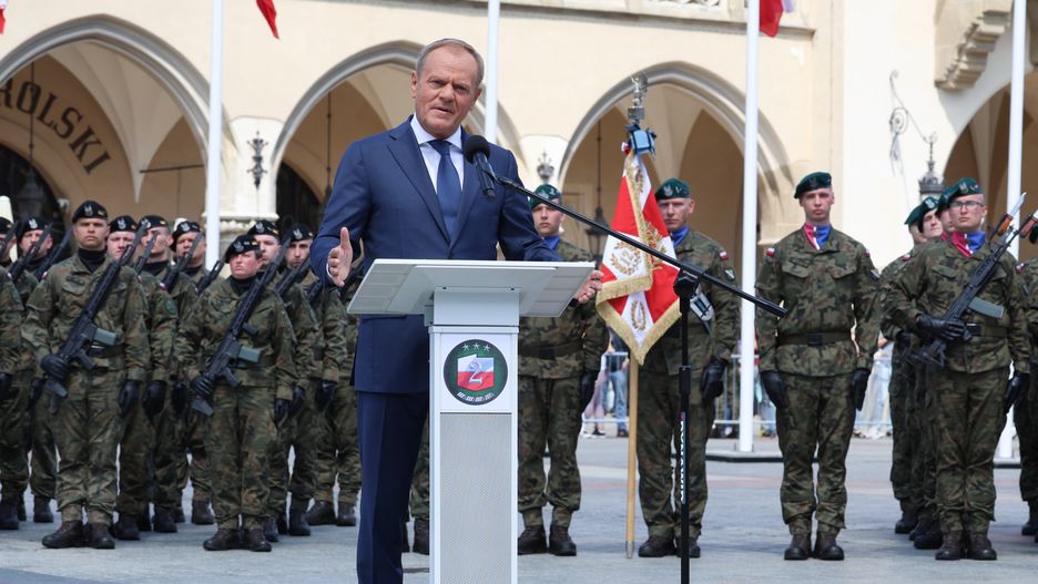 The Prime Minister of Poland, Donald Tusk speaks during the celebration of Monte Casino anniversary as well as establishing the holiday of the Command of the 2nd Polish Corps on Main Market Square in the old town of Krakow, Poland on May 18, 2024. Prime Minister announces 10 billion zoty in spending on new security measures for the Polish - Belarus border. (Photo by Dominika Zarzycka/NurPhoto via Getty Images)
