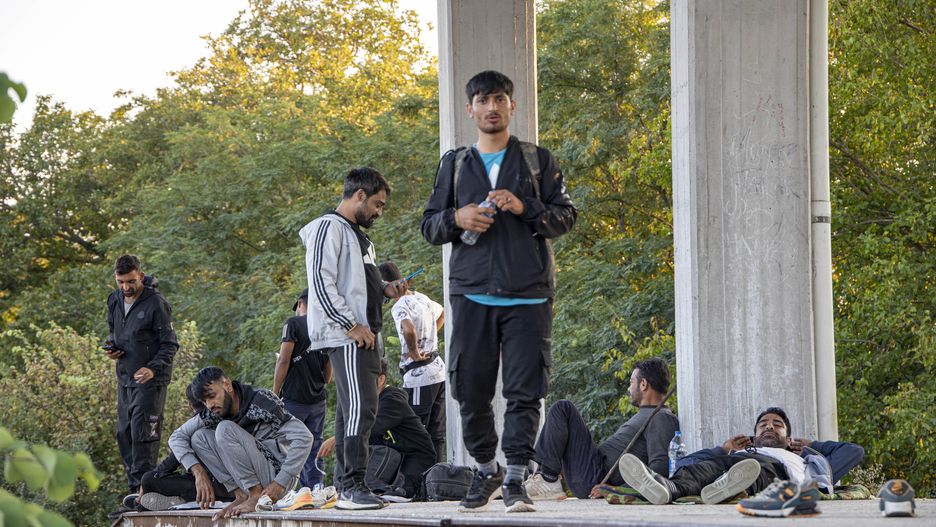 Asylum seekers as seen at Idomeni railway station, a few meters before the borderline between Greece and Northern Macedonia as seen resting and eating. They wait and form groups to cross the borders in the mountains and reach other European countries like Germany, France, Sweden etc via the Balkan route.  Refugees and migrants arrive at the train station from Turkey or Thessaloniki after a long multi-day journey on foot following marked routes in social media or the rails and highway but others via smugglers paying sometimes 2500 euro to smugglers to move them from Turkey here. Some of them complained for pushbacks from the N. Macedonian police after treating them violently and beating them. The station and the fenced part of the borders were guarded by Greek police and European Frontex forces. Most of the group were from Afghanistan, some from Syria, Iraq, Palestine, Pakistan, and Morocco. The flows of people arriving from Turkey are increasing every day as the refugee and migrant crisis is still ongoing. Eidomeni, Greece on October 2022  (Photo by Nicolas Economou/NurPhoto via Getty Images)