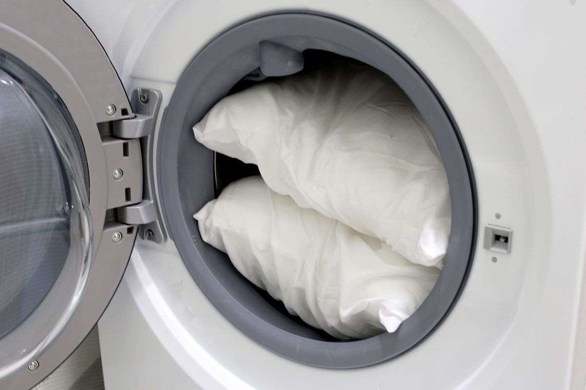 Washing cushions in the washing machine.
