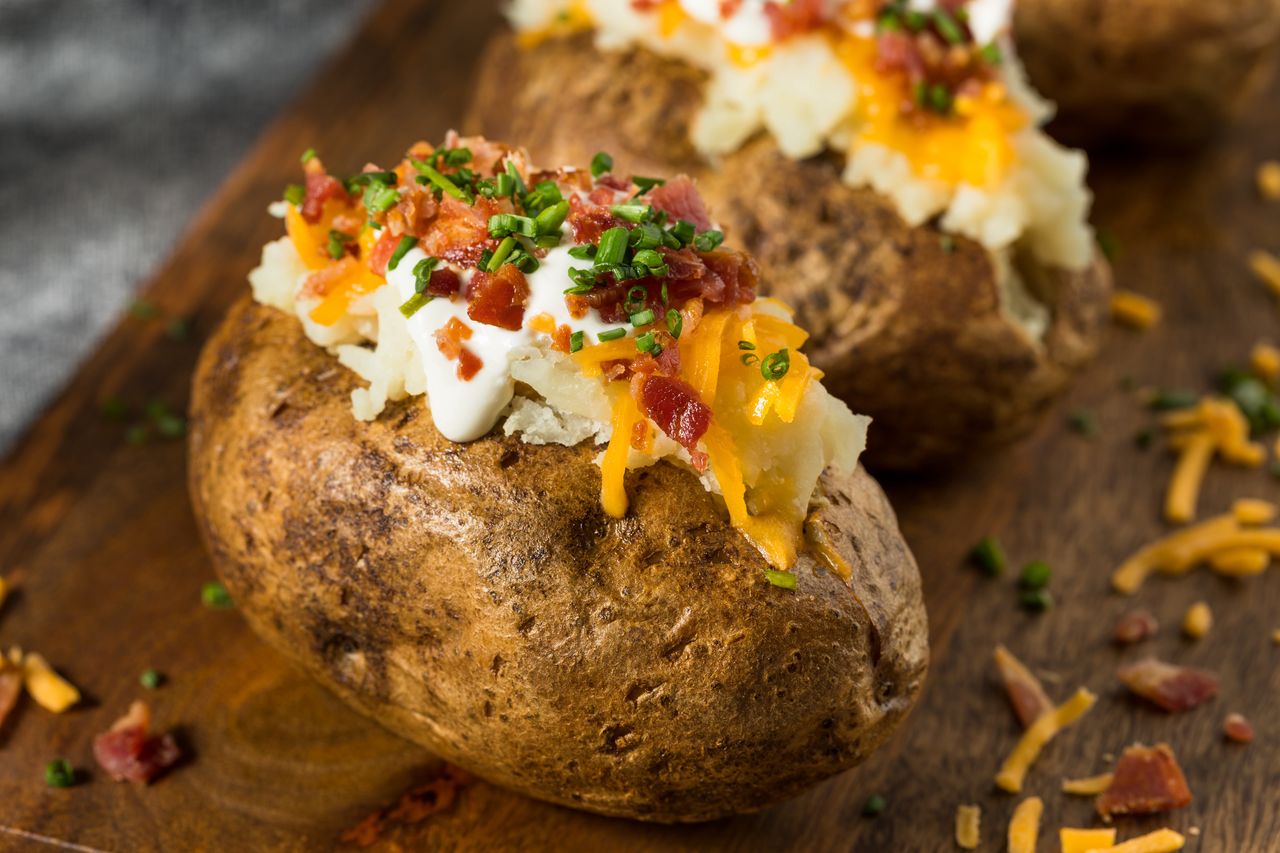 Baked potatoes can be served with toppings.