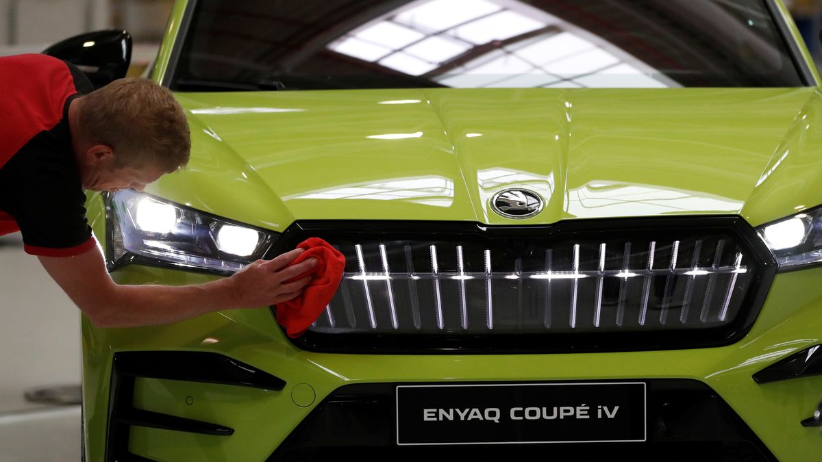 An employee wipes the bonnet of Skoda Enyaq as Skoda Auto carmaker launches production of MEB battery systems in Mlada Boleslav, Czech Republic, May 17, 2022.