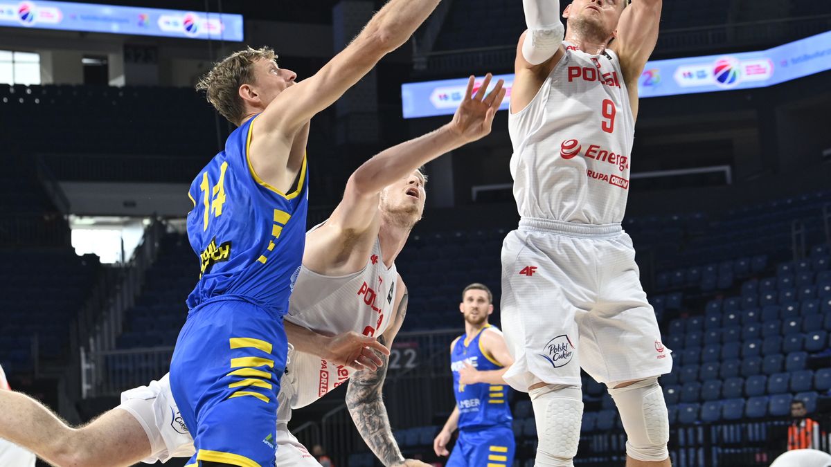 ISTANBUL, TURKEY - AUGUST 12: Mateusz Michal Ponitka #9 of Poland puts a shot up against Artem Pustovyi #14 of Ukraine during the International Friendly basketball match between Poland and Ukraine at Sinan Erdem Dome on August 12, 2022 in Istanbul, Turkey. (Photo by Seskim Photo/MB Media/Getty Images)