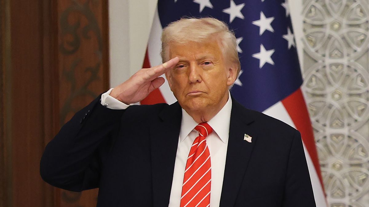 DOHA, QATAR - MAY 14: US President Donald Trump stands and salutes during the playing of the national anthem of the United States while attending a state dinner at the Lusail Palace on May 14, 2025, in Doha, Qatar. The visit underscores the strategic partnership between the United States and Qatar, focusing on regional security and economic collaboration.  (Photo by Win McNamee/Getty Images)