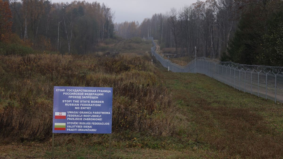ZERDZINY, POLAND - OCTOBER 28: A warning sign stands on the Russian side next to a Lithuanian border fence near the precise point where the borders of Poland, Lithuania and the Russian semi-exclave of Kaliningrad meet as seen on October 28, 2022 near Zerdziny, Poland. The monument marks the western tip of the strategically vital Suwalki Gap, an approximately 70km long stretch of land along the Lithuanian and Polish border between Kaliningrad and Russia-loyal Belarus. Should a military conflict ever break out, Russian control of the Suwalki Gap would cut the three Baltic states of Lithuania, Latvia and Estonia off from the rest of the European Union.  (Photo by Sean Gallup/Getty Images)