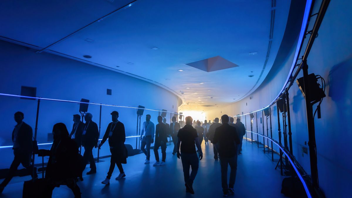BARCELONA, CATALONIA, SPAIN - 2024/02/01: Visitors to the ISE 2024 audiovisual fair are seen passing through the CO-OCCUR by HOC sound and light installation installed in the central hallway of the Barcelona-Gran Via Fair venue. From January 30 to February 2, the 20th edition of Integrated Systems Europe (ISE) 2024 will take place in Barcelona at the Fira de Barcelona-Gran Via venue, which brings together exhibitors from leading companies and manufacturers in the audiovisual sector. (Photo by Paco Freire/SOPA Images/LightRocket via Getty Images)