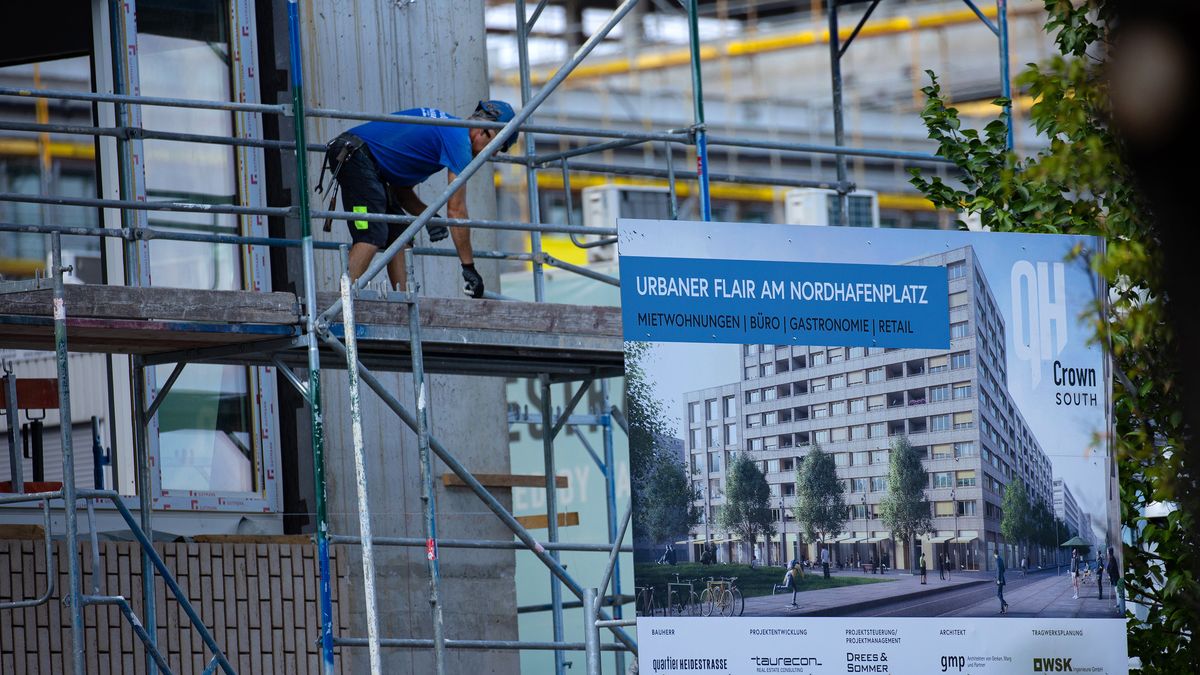 A construction worker on scaffolding at the Quartier Heidestrasse residential and commercial project, by Aggregate Holdings SA, in central Berlin, Germany, on Monday, July 4, 2022. Aggregate has sold parts of the Heidestrasse project in order to repay bonds and loans and shore up its finances after allegations of systemic fraud were leveled at Adler Group SA, a German real estate firm in which it was the largest shareholder. Photographer: Krisztian Bocsi/Bloomberg via Getty Images