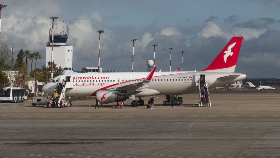 Air Arabia Maroc Airbus A320 aircraft as seen at Fes - Sais Airport near the city of Fez while passenger are seen boarding the plane. The Airbus jet airplane has the registration CN-NMN. Air Arabia Maroc is a Moroccan low cost airline subsidiary of AirArabia. Fes, Morocco on January 19, 2020 (Photo by Nicolas Economou/NurPhoto via Getty Images)