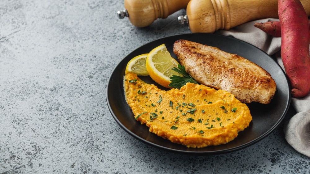 Delicious,Mashed,Sweet,Potatoes,And,Fried,Chicken,Breast,On,A
chicken,batatas,yellow,puree,vegetable,agriculture,red,rustic,slice,potato,root,vegetarian,ingredients,mash,wood,diet,organic,ingredient,yam,asia,health,chiken,vegan,brown,food,fried,meal,orange,wooden,tuber,baked,roasted,edible,ipomoea,tasty,fresh,sweet,breast,crop