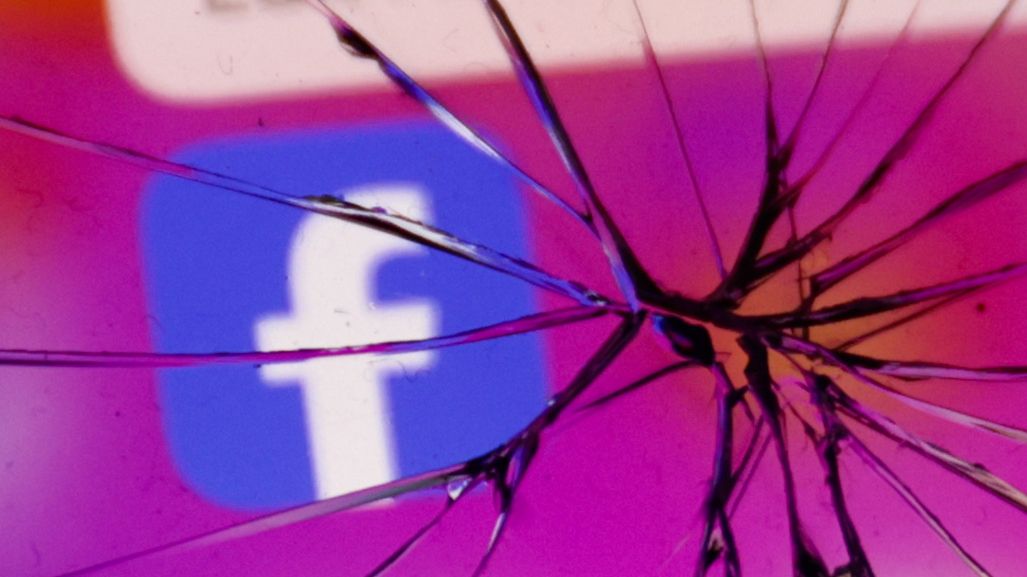 Facebook icon displayed on a phone screen is seen through the broken glass in this illustration photo taken in Krakow, Poland on April 25, 2024. (Photo by Jakub Porzycki/NurPhoto via Getty Images)