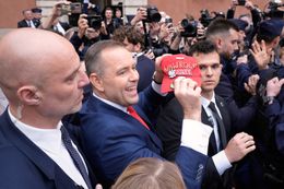 President elect Karol Nawrocki greets fans and supporters after his certification ceremony at the Royal Castle Square in Warsaw, Poland on 11 June, 2025. (Photo by Jaap Arriens/NurPhoto via Getty Images)