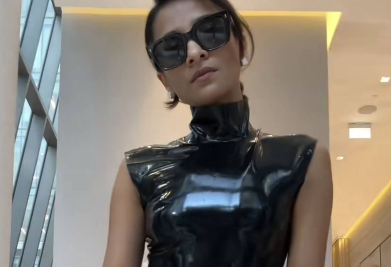 The TikToker wears latex to the office.