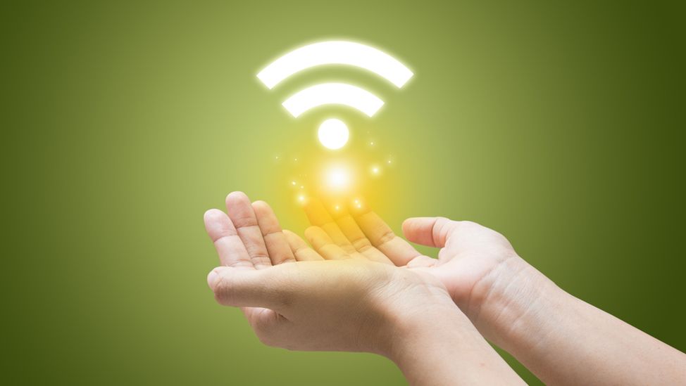 Wifi symbol in a hand businessman