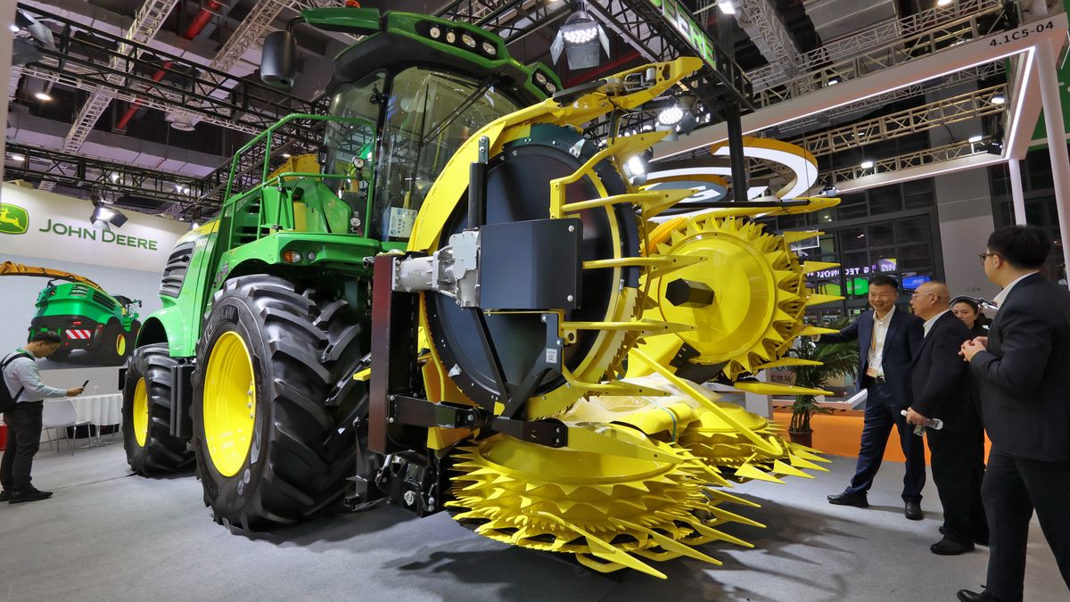 The audience learns about the self-propelled silage harvester at the John Deere booth at the 8th CIIE in Shanghai, China, on November 6, 2025. (Photo by Costfoto/NurPhoto via Getty Images)