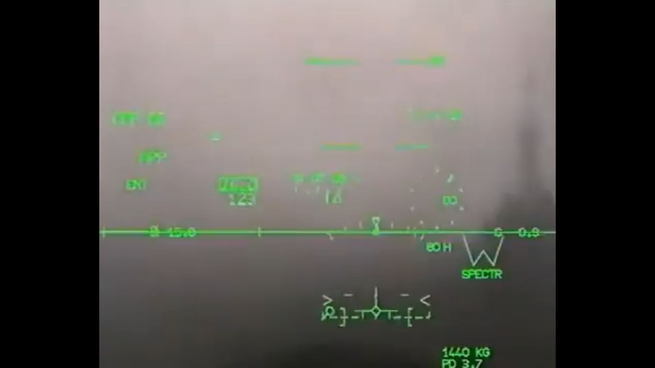 Rafale M landing during dense fog on an aircraft carrier.