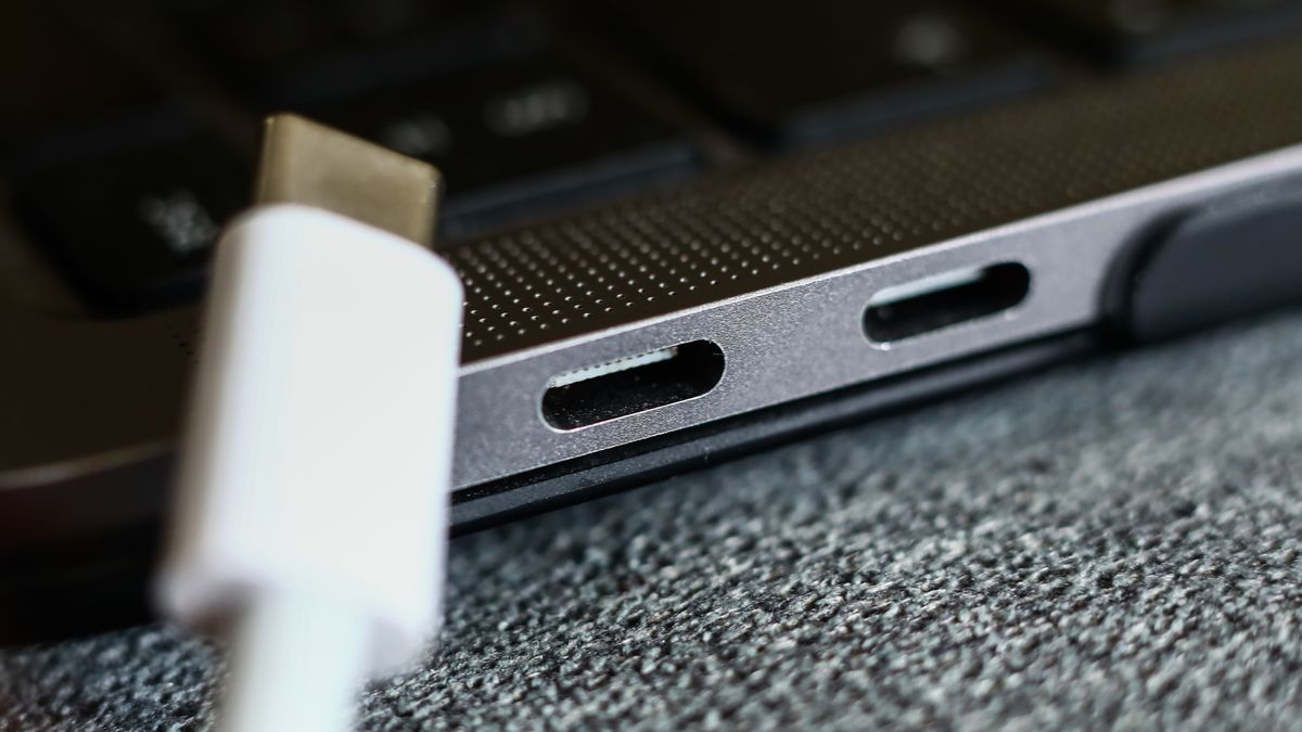 USB-C plug and USB-C ports in a laptop are seen in this illustration pgoto taken in Krakow, Poland on September 21, 2022. (Photo by Jakub Porzycki/NurPhoto via Getty Images)