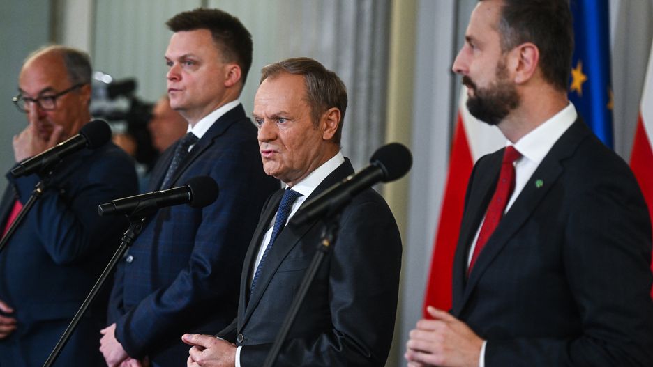 WARSAW, POLAND - OCTOBER 24: The leader of Civic Coalition (KO), Donald Tusk stands among the leader of Poland 2050 Party, Szymon Holownia, the Leader of Polish People's Party (PSL), Wladyslaw Kosiniak Kamysz and one of the Leaders of the New Left, Wlodzimierz Czarzasty as they give a press statement in Warsaw, Poland on October 24, 2023. On Tuesday and Wednesday, Oct . 24 and 25 President Andrzej Duda will hold individual consultations with leaders of political parties that have won seats in the parliament of the new term. With the results of the Parliamentary elections out, Poland's democratic opposition made of the Civic Coalition, The Third Way Political alliance, and The New Left has the chance to rule with a majority and all have refused to enter a coalition with the ruling government party, Law and Justice. (Photo by Omar Marques/Anadolu via Getty Images)