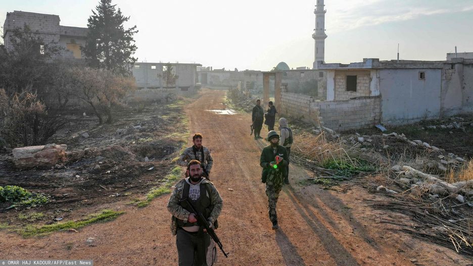 Temporary
Fighters enter the village of Talhiyah, located east of the northwestern Syrian city of Idlib near the Taftanaz military airport, after the area was taken over by Jihadists and their Turkish-backed allies in the latest battles with government forces in the northern Syrian Aleppo province, on November 29, 2024. Hayat Tahrir al-Sham (HTS) jihadists and allied factions launched this week a shock offensive against Syrian government troops and sparked the deadliest battle the country has seen in years, with the violence killing so far 242 people, according to the Syrian Observatory for Human Rights. The war monitor said most of the victims were combatants on both sides but also including civilians. (Photo by Omar HAJ KADOUR / AFP)
OMAR HAJ KADOUR