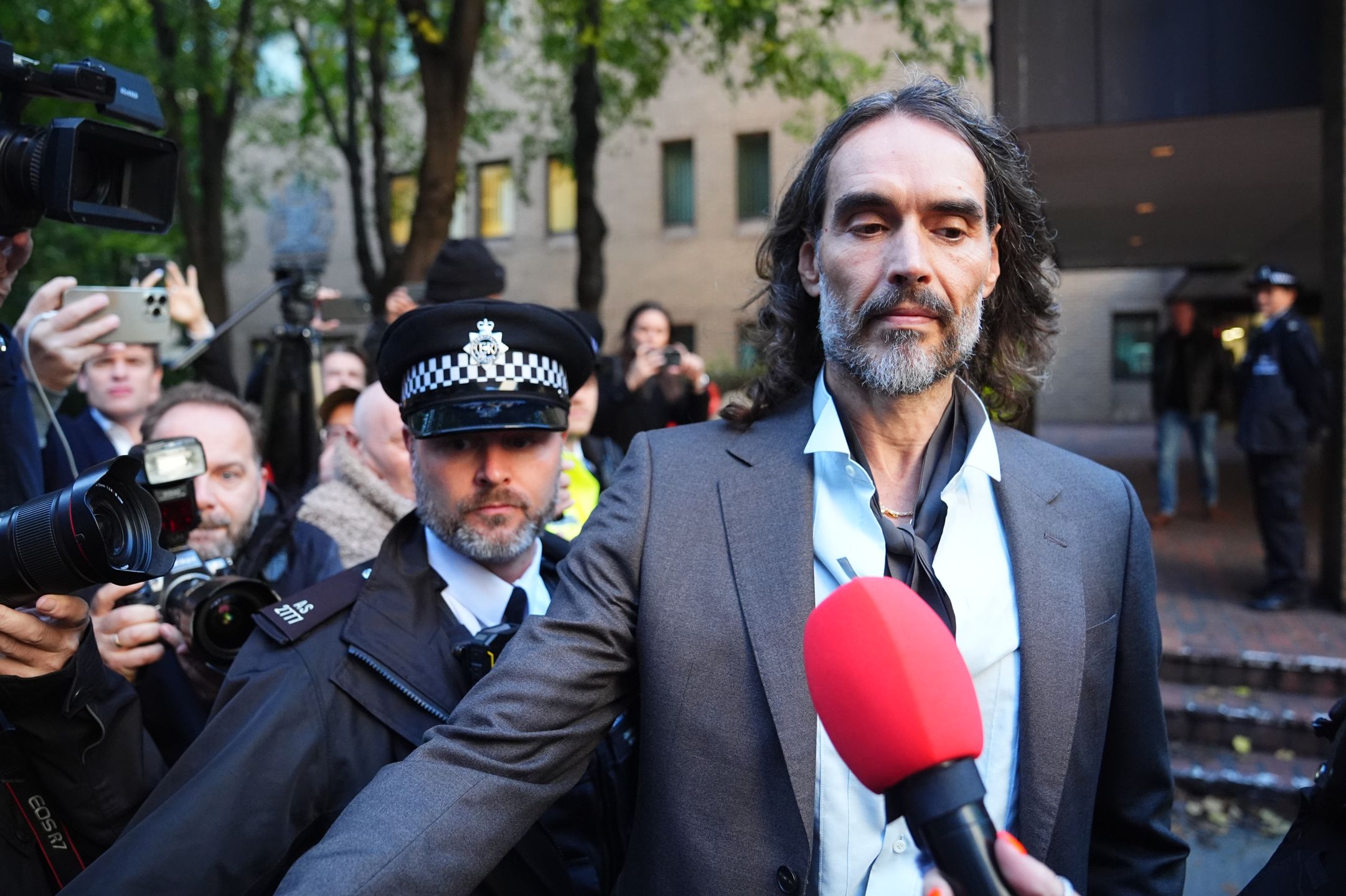 Russell Brand leaving Southwark Crown Court, London, where he faces three charges of rape, indecent assault, and three counts of sexual assault relating to six women. Picture date: Tuesday October 27, 2026. (Photo by James Manning/PA Images via Getty Images)