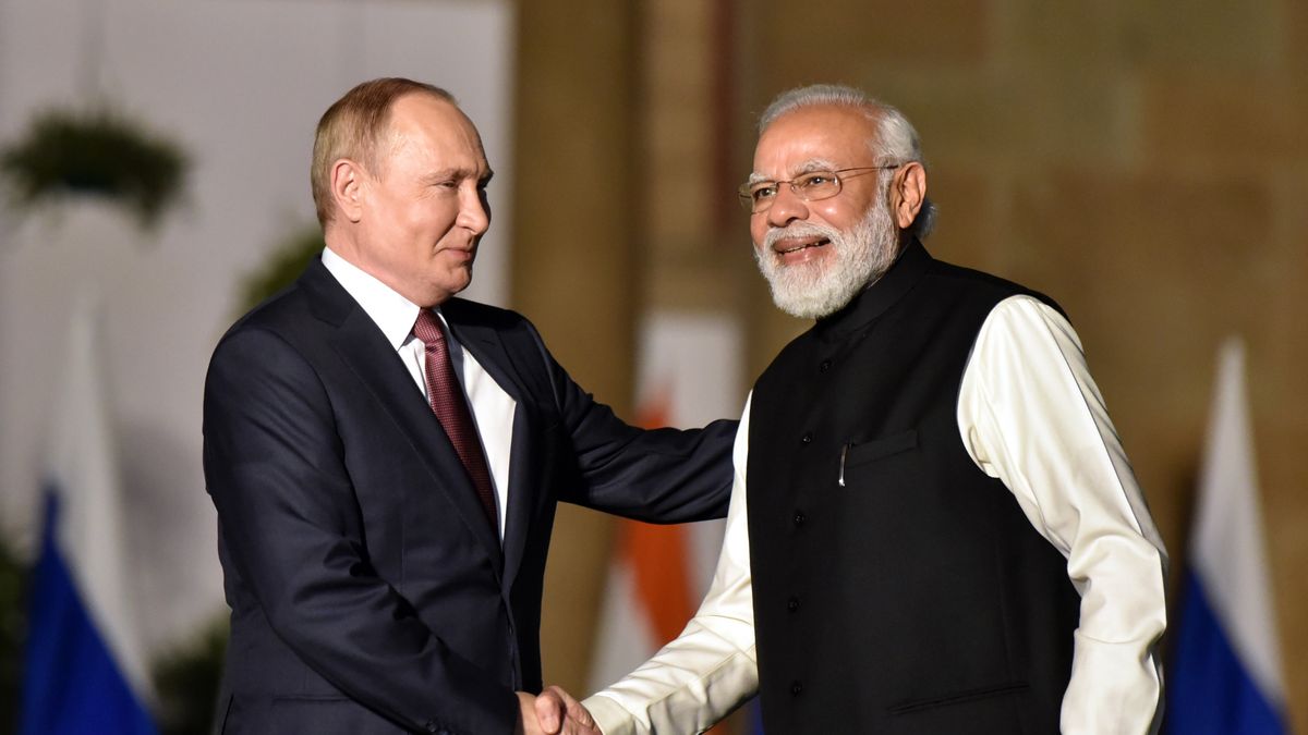 NEW DELHI, INDIA - DECEMBER 6: Indian Prime Minister Narendra Modi shakes hands with Russian President Vladimir Putin during their meeting at Hyderabad House, on December 6, 2021 in New Delhi, India. (Photo by Sonu Mehta/Hindustan Times via Getty Images)