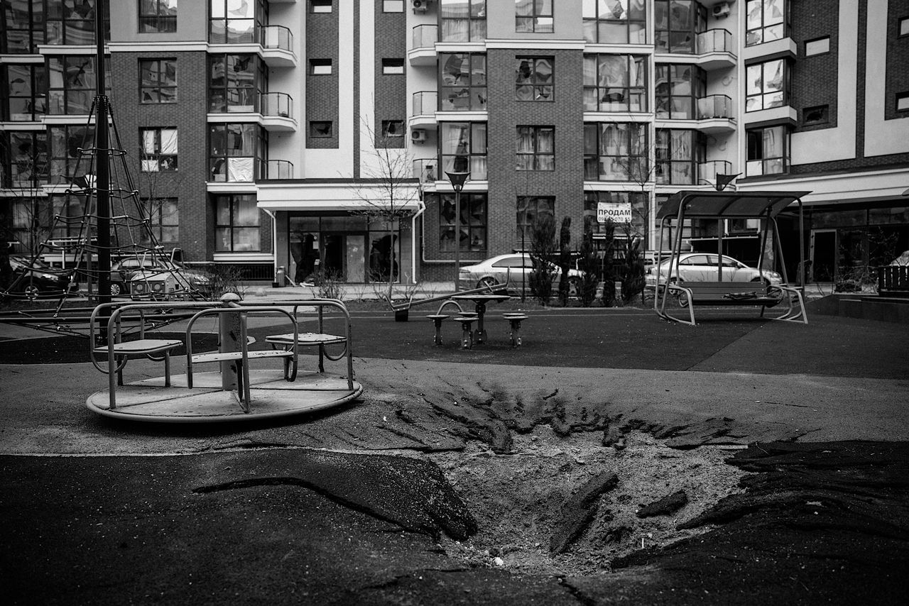 A crater after a rocket blast in a playground