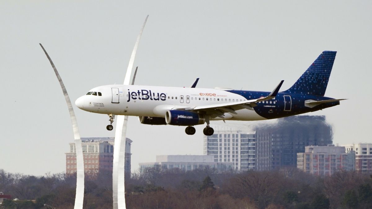 Temporary
A JetBlue passenger flight passes the Air Force Memorial as it prepares to land at Reagan Washington National Airport in Arlington, Va., across the Potomac River from Washington, Wed., Jan. 19, 2022. The airline industry is raising the stakes in a showdown with AT&T and Verizon over plans to launch new 5G wireless service this week, warning that thousands of flights could be grounded or delayed if the rollout takes place near major airports. (AP Photo/J. Scott Applewhite)
AP