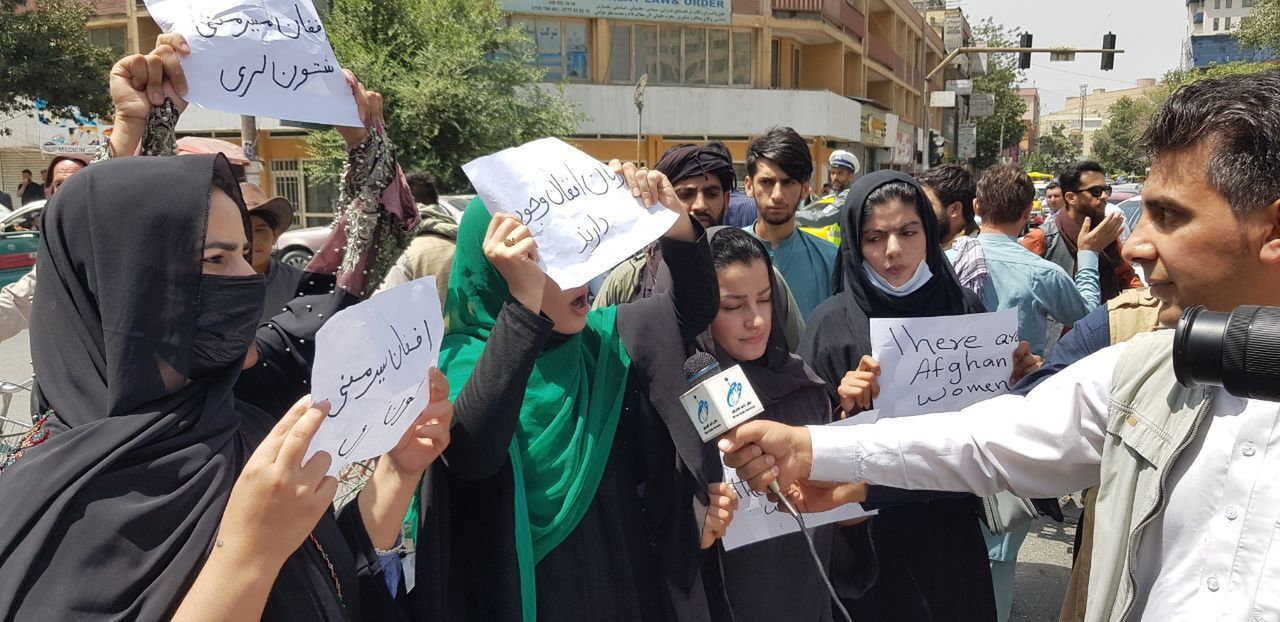 KABUL, AFGHANISTAN - AUGUST 17: Afghan women, holding placards, gather to demand the protection of Afghan women's rights in front of the Presidential Palace in Kabul, Afghanistan on August 17, 2021. (Photo by Sayed Khodaiberdi Sadat/Anadolu Agency via Getty Images)