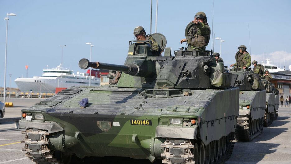 arch25
This picture taken on September 14, 2016 shows Swedish military armored vehicles in the harbour of Visby, on the Gotland island in Sweden.  Sweden announced Thursday, March 2, 2017 that it will reintroduce compulsory military service starting this summer to respond to global security challenges including from Russia.  / AFP PHOTO / TT News Agency / SOREN ANDERSSON / Sweden OUT
SOREN ANDERSSON