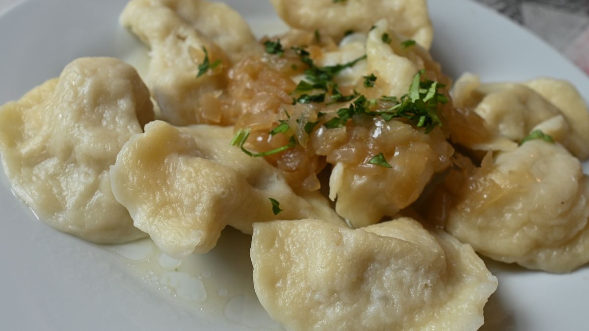 A plate with Ukrainian Pierogi (filled dumplings) topped with fried onions served at a milk bar in Krakow.
As a result of current events in Ukraine (2022 Russian invasion of Ukraine), many restaurateurs from all over Poland are removing 'Russian dumplings' from the menu and change the name  to 'Ukrainian' dumplings'.
On Wednesday, May 23, 2022, in Krakow, Lesser Poland Voivodeship, Poland. (Photo by Artur Widak/NurPhoto via Getty Images)