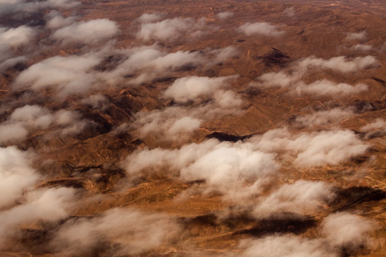 Mountains and clouds in the Atacama Desert, Chile, on Thursday, March 14, 2024. After a spectacular bust, battery-metal lithium is showing tentative signs of life on speculation the retracement that convulsed the market last year has forced the conditions for a recovery. Photographer: Cristobal Olivares/Bloomberg via Getty Images