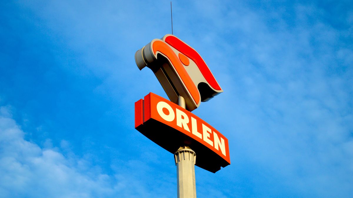 Orlen petroleum company tall pylon sign featuring red and orange logo displayed against a vivid bright blue sky with scattered white clouds
A tall Orlen fuel company pylon sign rises against a vivid blue sky, displaying the distinctive red and orange brand logo above the bold red Orlen name sign. The sign is mounted on a metal pole with wispy white clouds scattered across the background. Suitable for editorial coverage of the energy sector, fuel retail, and European oil industry topics.
orlen, sign, logo, gas, station, fuel, petroleum, oil, energy, company, brand, branding, pylon, pole, red, orange, blue, sky, clouds, outdoor, exterior, signage, corporate, commercial, advertisement, advertising, industry, retail, polish, poland, european, europe, business, enterprise, petrol, refueling, service, pump, roadside, street, daylight, sunny, bright, vivid, colorful, tall, modern, architecture, infrastructure, landmark, orlen, sign, logo, gas, station, fuel, petroleum, oil, energy, company, brand, branding, pylon, pole, red, orange, blue, sky, clouds, outdoor, exterior, signage, corporate, commercial, advertisement, advertising, industry, retail, polish, poland, european, europe, business, enterprise, petrol, refueling, service, pump, roadside, street, daylight, sunny, bright, vivid, colorful, tall, modern, architecture, infrastructure