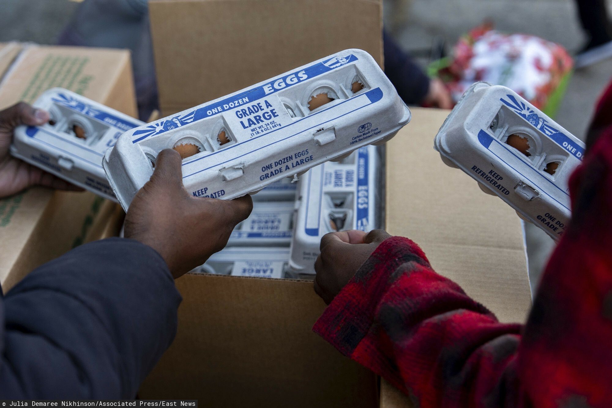 Temporary
Abou Sow hands out cartons of eggs to people waiting in line to receive free eggs from FarmerJawn Agriculture, Friday, March 21, 2025, in the Harlem neighborhood of New York. (AP Photo/Julia Demaree Nikhinson)
Julia Demaree Nikhinson