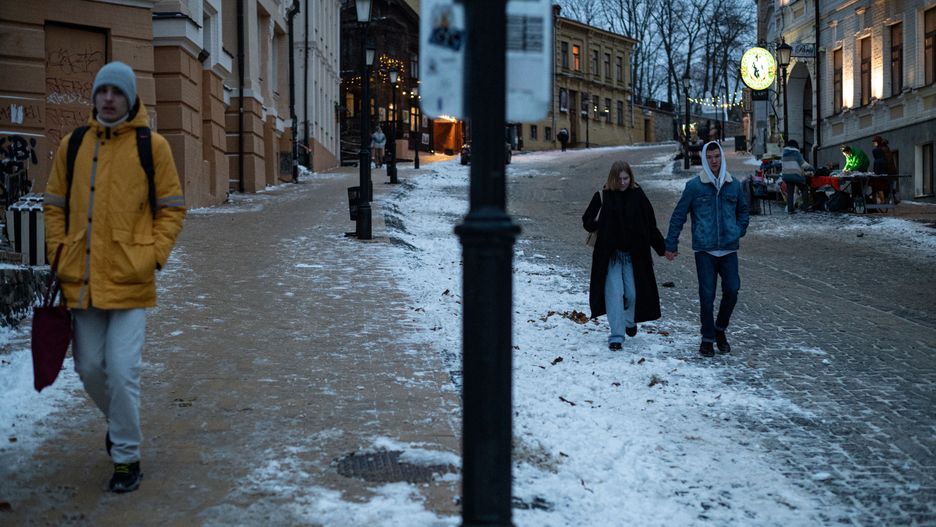 KYIV, UKRAINE - NOVEMBER 28: People walking down a snowy street on November 28, 2023 in Kyiv, Ukraine. (Photo by Danylo Antoniuk/Global Images Ukraine via Getty Images)