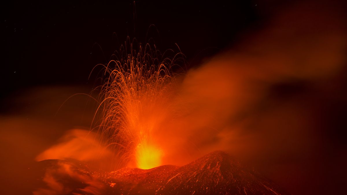 CATANIA, ITALY - APRIL 08: A view of Etna Volcano on the night of April 8, producing lively Strombolian activity throughout the night from the southeast crater, on which two active vents could be observed, one of which was located lower than the main one, at Nicolosi near Catania, Italy on April 08, 2025. Strombolian explosions, accompanied by loud booms audible from surrounding population, characterized tonight's activity. The aviation warning issued in the late night of April 07 changed from red to yellow in the early afternoon hours of April 08. (Photo by Salvatore Allegra/Anadolu via Getty Images)