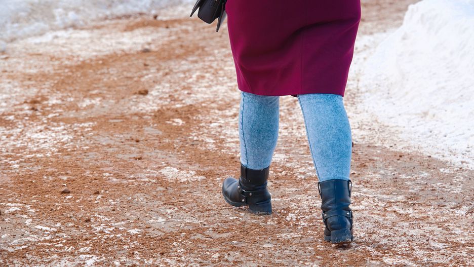 Woman walking on snowy sidewalk spreading with sand, prevention of pedestrians injury. Road service spreading sand on snowy road, sand mixture help increase friction of icy road surfaces in wintersidewalk, sand, road, spread, icy, way, foot, leg, ice, woman, slush, grit, sanding, slippery, walk, snow, shoes, pavement, snowdrift, dirt, footpath, pedestrian, step, path, winter, street, boot, dirty, mud, footstep, walking, safety, danger, footwear, risk, cleaning, pathway, slide, city street, covered, maintenance, mixture, blizzard, damage, stains, injury, spreading, prevention, friction, snowy, woman, sand, snow, sidewalk, winter, foot, spread, slippery, icy, road, injury, slush, way, ice, leg, grit, sanding, walk, shoes, pavement, snowdrift, dirt, footpath, pedestrian, step, path, street, boot, dirty, mud, footstep, walking, safety, danger, footwear, risk, cleaning, pathway, slide, city street, covered, maintenance, mixture, blizzard, damage, stains, spreading, prevention, friction