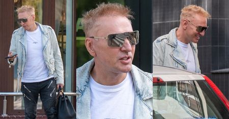 Nowa twarz Krzysztofa Gojdzia na spacerze z psem i torbą za 120 tysięcy złotych. Zapachniało Hollywood?